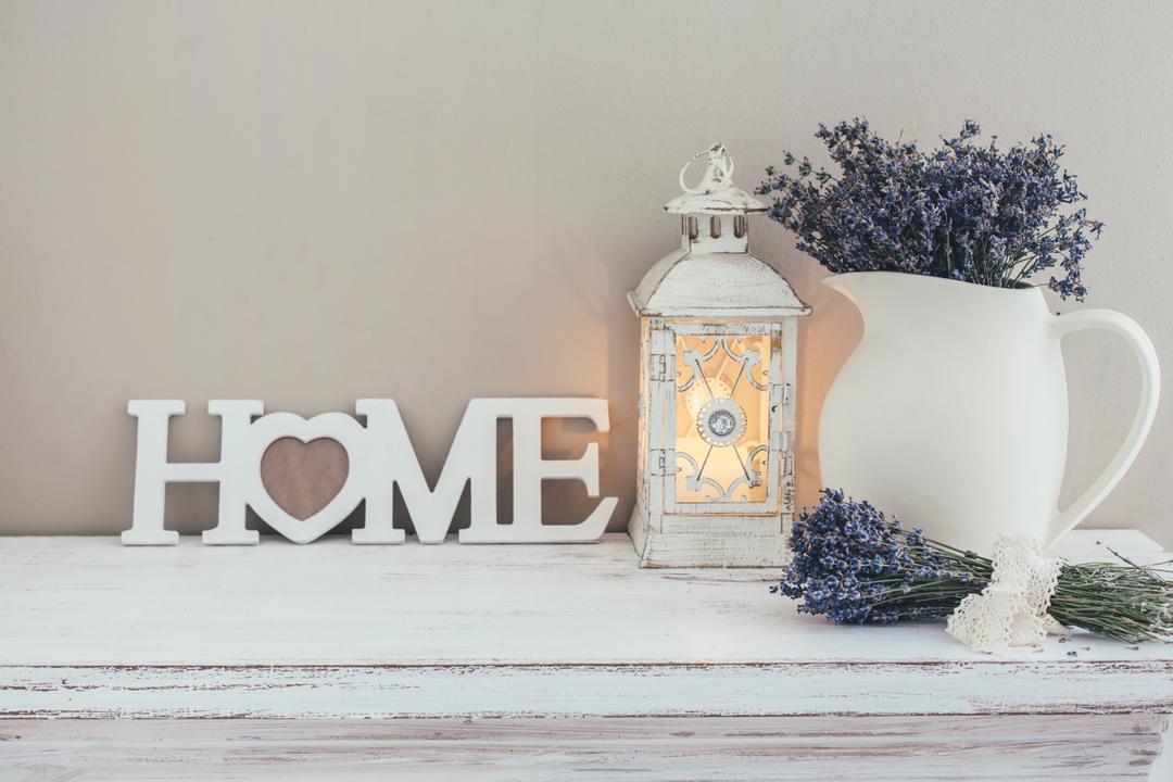A warm, lived-in home interior with a Home sign