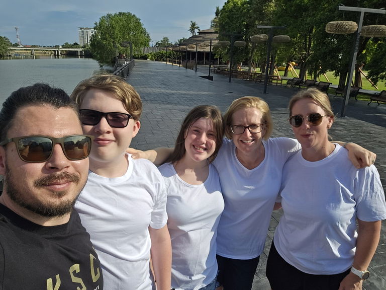 Group of smiling participants posing for a selfie at a Care to Change Walk for Mental Health Awareness event