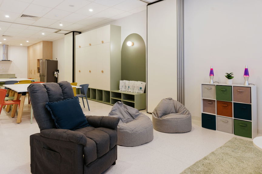 Sensory and relaxation lounge with a recliner and bean bags at the Morayfield Hub