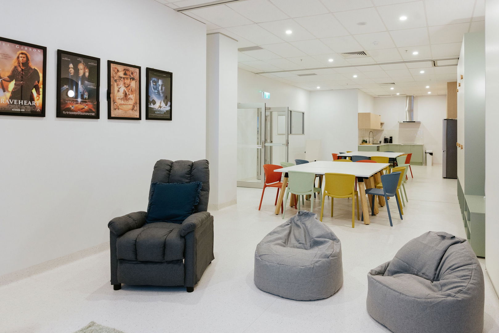 Open lounge and activity space with bean bag seating and framed artwork at the Morayfield Hub